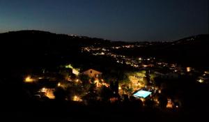 a town on a hill at night with lights at Relais B&B Betty Bike in Sasso Feltrio