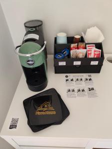 a counter top with a coffee maker and a blender at PiaveHome in San Donà di Piave