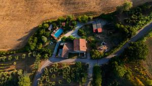 an aerial view of a house in the middle of a road at Relais B&B Betty Bike in Sasso Feltrio