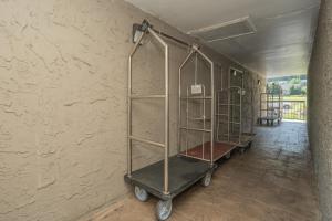 a hallway with three metal shelves in a wall at Olde Gatlinburg Rentals in Gatlinburg