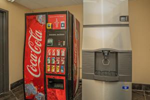 a coca cola machine next to a drink dispenser at Olde Gatlinburg Rentals in Gatlinburg