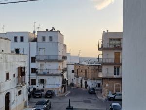 a view of a city with cars parked on the buildings at Frangio' in Noci