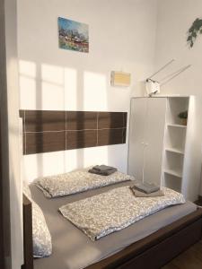 two beds in a room with two mattresses at Apartman Hasičská in Trenčín