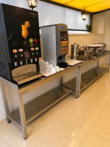 a counter in a kitchen with a coffee machine on it at Giray Butik Hotel in Alanya