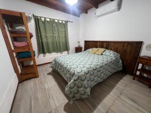 a bedroom with a bed and a book shelf at EBC SUM&Aparts in San Miguel del Monte