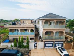 an overhead view of a house with a car parked in front at Appartement Güstrow "free energy from solar Panels" in Lomé