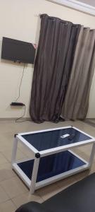 a ping pong table in front of a window at cœur d'eden in Vougomé +2 photos