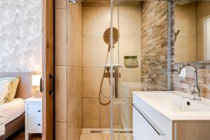 a bathroom with a shower and a sink at Lou-Lou in Zandvoort +30 photos