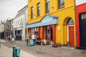a street with people walking down the street at Llety Arall in Caernarfon