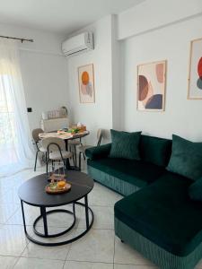 a living room with a couch and a table at The View Xanthi in Xanthi
