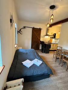 a bedroom with a bed with two towels on it at Ferienwohnung Sonnenblick in Hinterstoder +40 photos