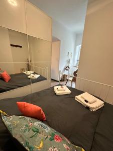 a room with two beds and a large mirror at Ferienwohnung Sonnenblick in Hinterstoder