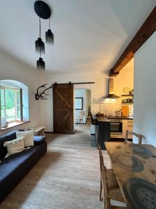 a living room with a couch and a table at Ferienwohnung Sonnenblick in Hinterstoder