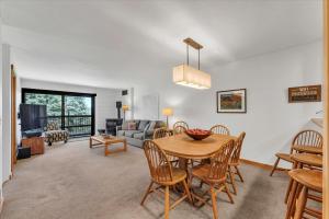 a living room with a table and chairs and a couch at Chez Vaupen in Alpine Meadows