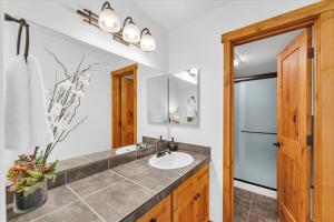 a bathroom with a sink and a mirror at Chez Vaupen in Alpine Meadows +49 photos