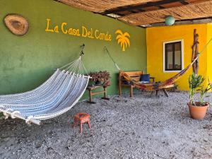 a room with two hammocks in front of a building at La Casa del Conde in Naranjo