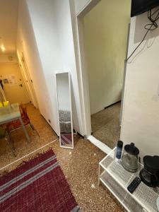 a mirror on the floor in a room at Private Space near City Center in Genoa