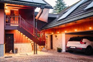 a car parked in the garage of a house at Apartmán na Pasekách in Bystrzyca