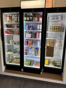 a refrigerator with its doors open and its contents at Bageriet, 1 room, 2 beds in Varberg
