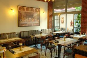 a restaurant with tables and chairs in a room at madame roza in Istanbul
