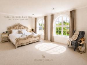 a bedroom with a bed and a chair and a window at Breezery Retreat - 8 Min to Airport - Indoor Pool Sauna Wellness Billiards Sports Court in Richmond