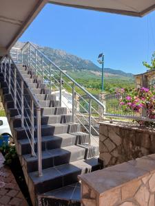 a set of stairs with a view of a mountain at vila Rosmarin in Dobra Voda