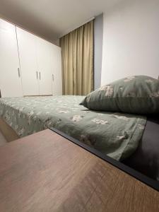 a bedroom with a bed with a pillow on it at Cartagena Urban Escape in Brčko +13 photos