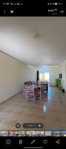 a living room with a table and a dining room at Ghazala resort in Marsa Matruh