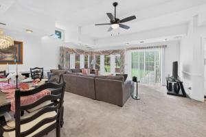 a living room with a couch and a table at Muirs Chapel Retreat in Greensboro
