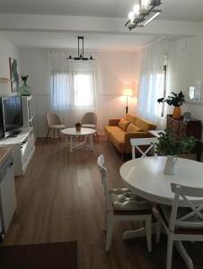 a living room with a couch and a table at Cereza Home in Cabezuela del Valle