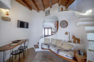 a living room with a couch and a table at Albufeira Oasis Pool & Views in Albufeira