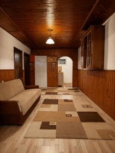 a living room with a couch and a floor at Pure Sleep in Prizren