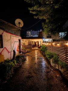 a night view of a building with lights on it at Pure Sleep in Prizren