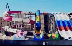a row of different types of water slides at Tavira شاليه in Ras Sedr