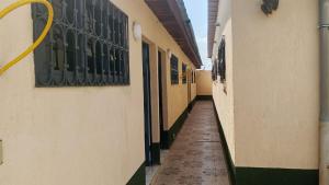 an empty hallway of a building with a hallway at Résidence IRIS Yamoussoukro in Yamoussoukro