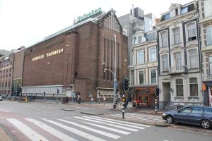 a city street with a traffic light and buildings at Blossoms City Hotel in Amsterdam