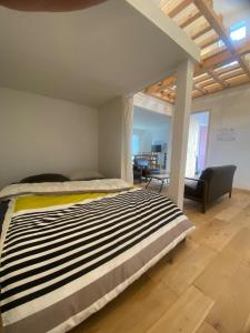 a bedroom with a bed and a living room at Magical Skate Casa in Wakayama
