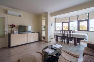 a living room with a couch and a table at StaynFeel 03 in Fátima