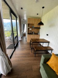 a living room with a couch and a table at Container House Zakani in Zak'at'kari