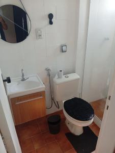 a small bathroom with a toilet and a sink at Studio Royal Trianon Centro in Campos dos Goytacazes