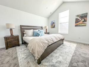 a bedroom with a large bed and a window at Retro Ski Chalet in Heber City