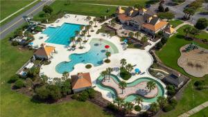 an aerial view of a pool at a resort at Fenced Yard, Pool, Lazy River SAV Area Oasis! in Savannah
