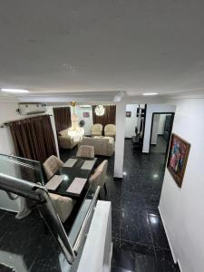 a living room with a couch and a table at ParamountLuxe 4 bedroom duplex in Ikeja in Ikeja