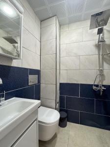 a bathroom with a toilet and a sink and a shower at Ayliz City Otel in Manavgat +14 photos