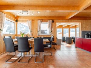 a dining room with a table and chairs at Tauern Lodge in Hohentauern +38 photos