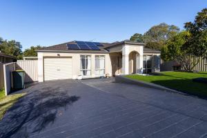 a house with solar panels on the roof at 3BR Guesthouse w Sunroom Near Stanhope Leisure in Glenwood