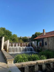 a waterfall in the middle of a waterfalliterator at Domus Viriato in Viseu