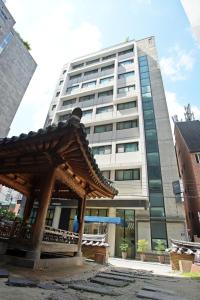 a large building with a pavilion in front of it at Hotel Dada Gyeongbokgung in Seoul