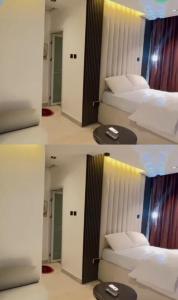 a room with three beds in a room at Damah's property in Gwarinpa