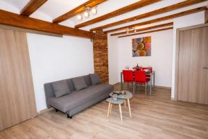 a living room with a couch and a table at apartamento las torres-botanico con 2 habitaciones in Valencia